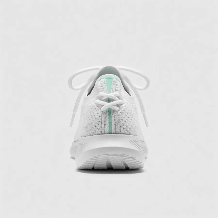 Rear view of the same white sneaker with matching lighting
