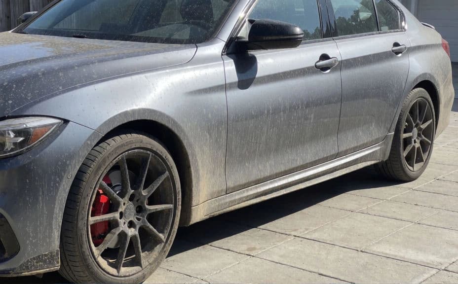 Dusty dirty sedan before detailing