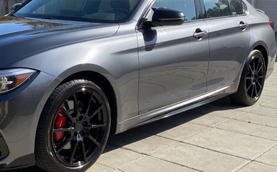 The same sedan freshly detailed and glossy
