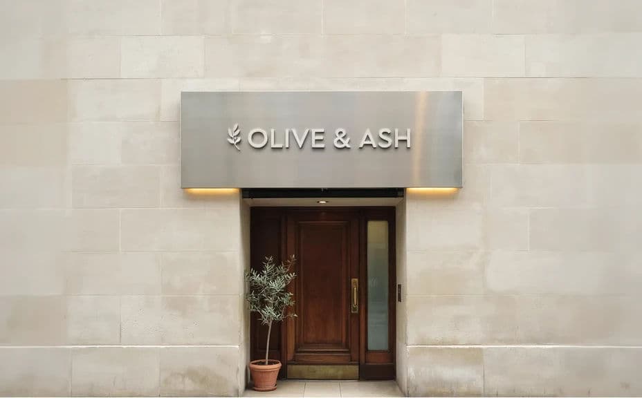 Restaurant logo shown on a storefront sign mockup