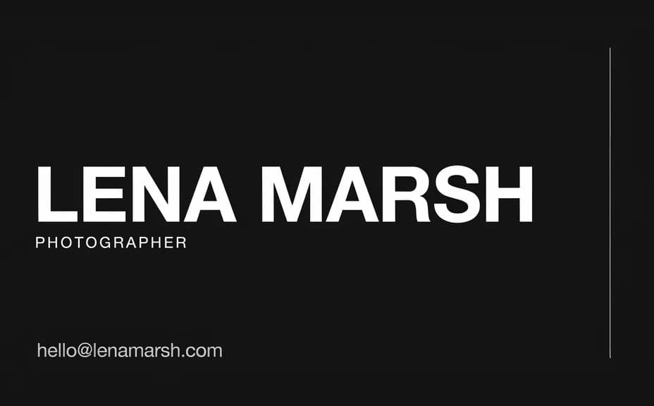 Photographer business card design with a large name on a dark card