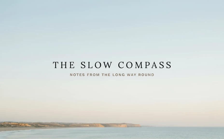 Travel blog header with the title centred over open sky above a coastline