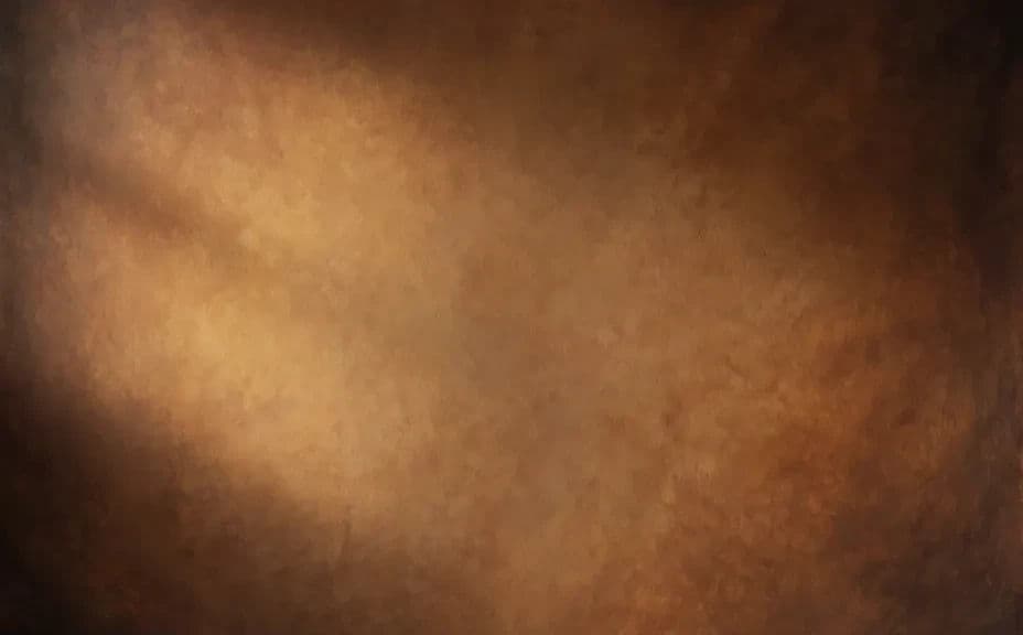 Warm mottled canvas studio backdrop with a soft light falloff