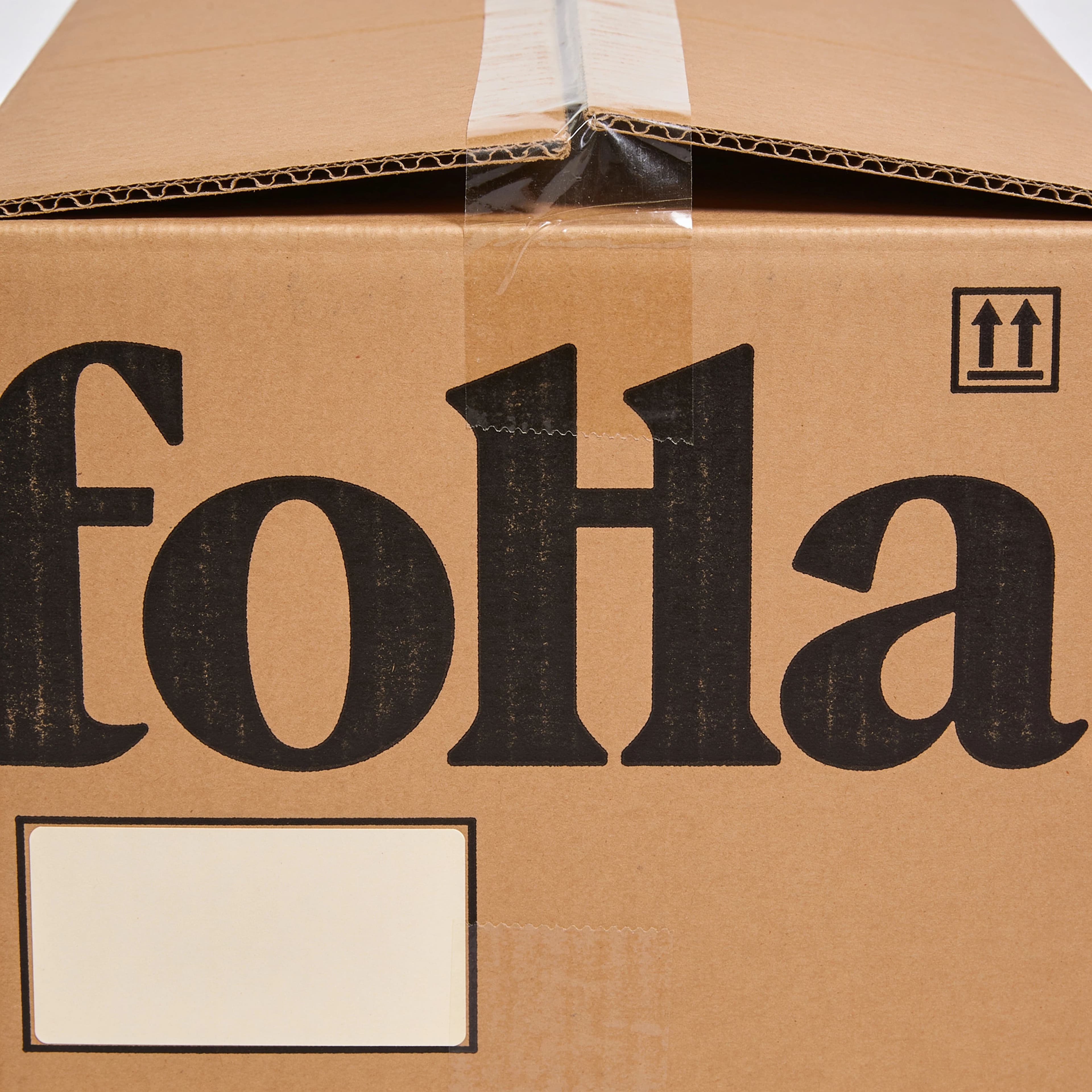 Shipping carton printed in one colour with a stencilled look, generated with Seedream 4.5