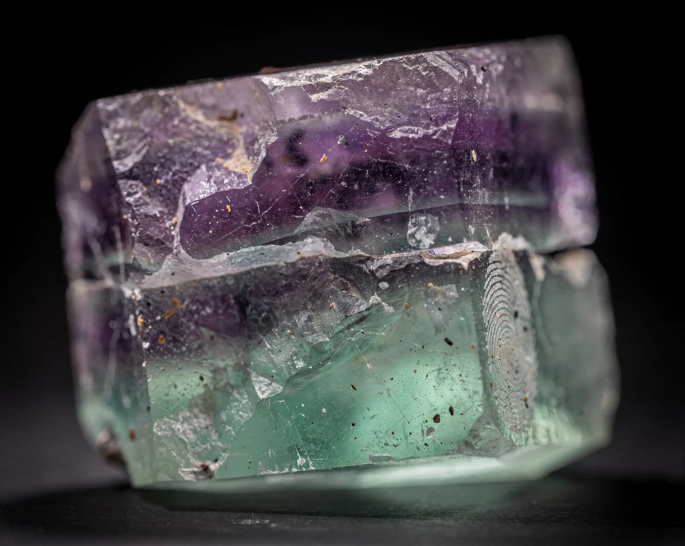 Macro photograph of a fluorite crystal cleavage face showing internal colour banding, generated with Flux 2 Pro