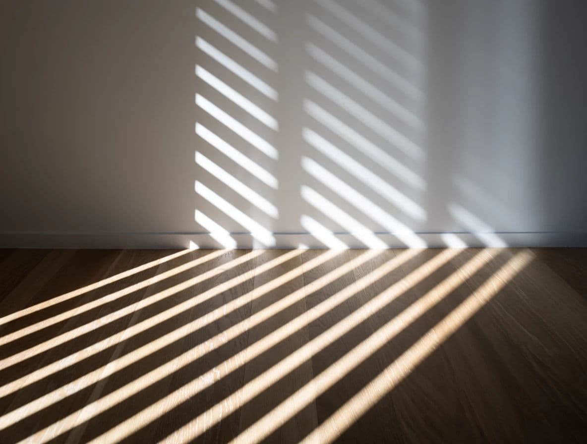 Photograph of hard sun through louvres laying parallel stripes across a bare floor, generated with Krea 2 Medium