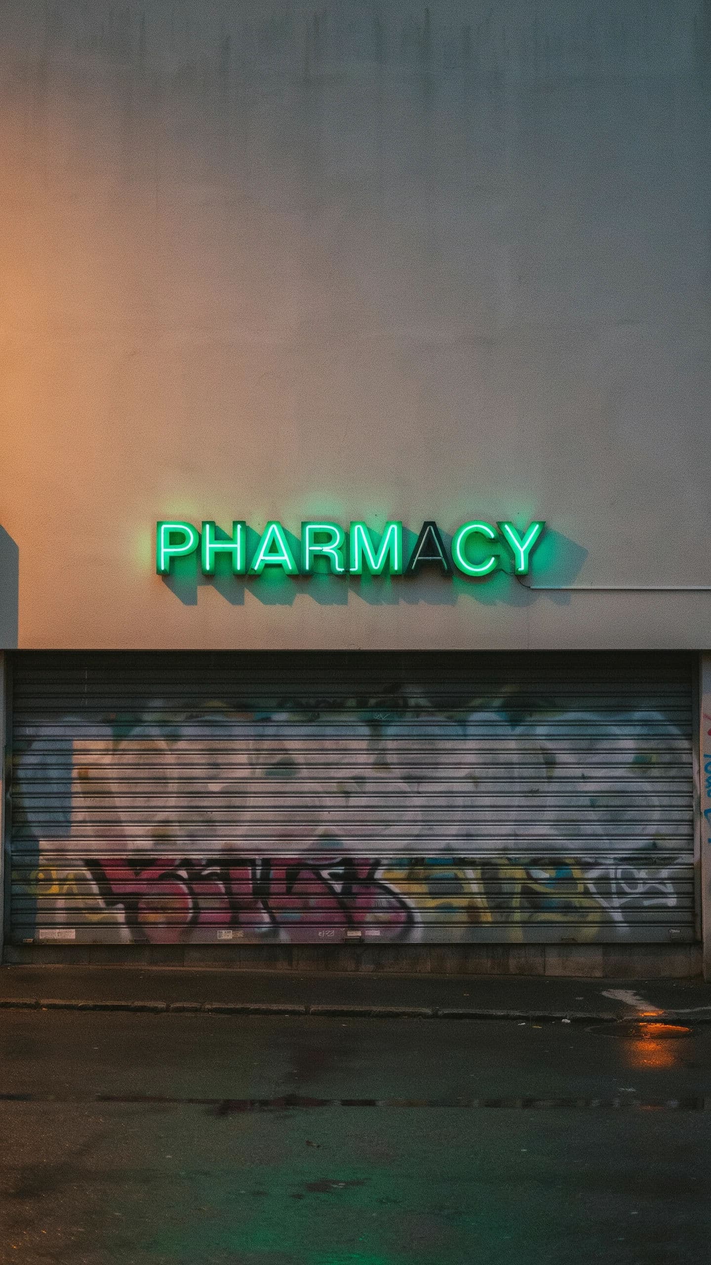 Vertical photograph of a shop sign reading PHARMACY with one letter dead, generated with Ideogram 4.0