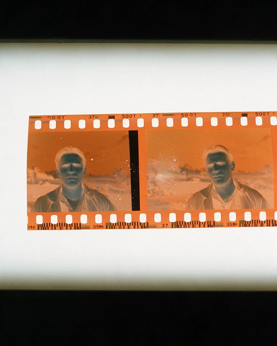 Vintage colour negative strip on a lightbox showing the orange base and inverted colours, generated with Seedream 5.0 Pro