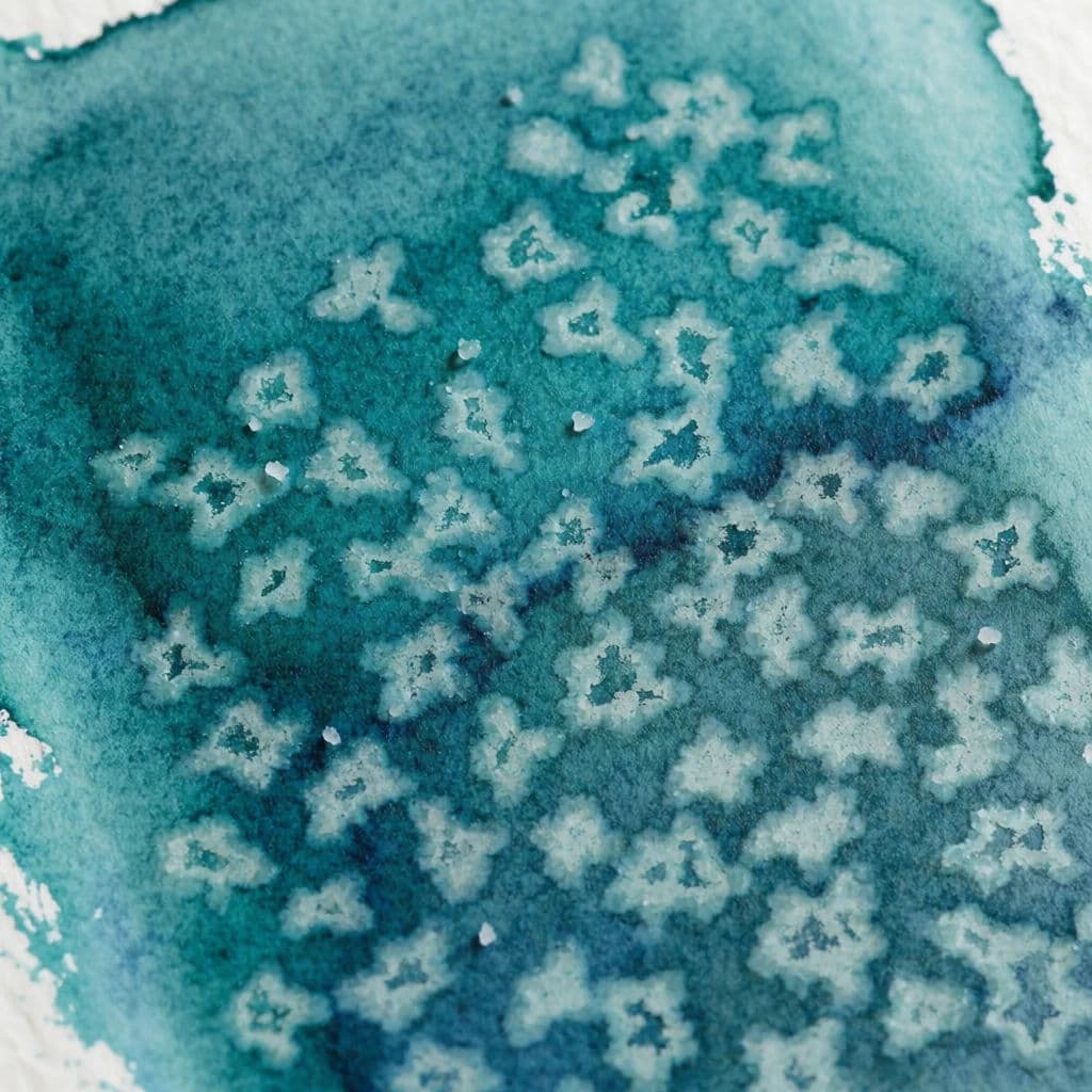 Watercolour texture study where salt has pushed pigment aside leaving pale starbursts, generated with Krea 2 Medium
