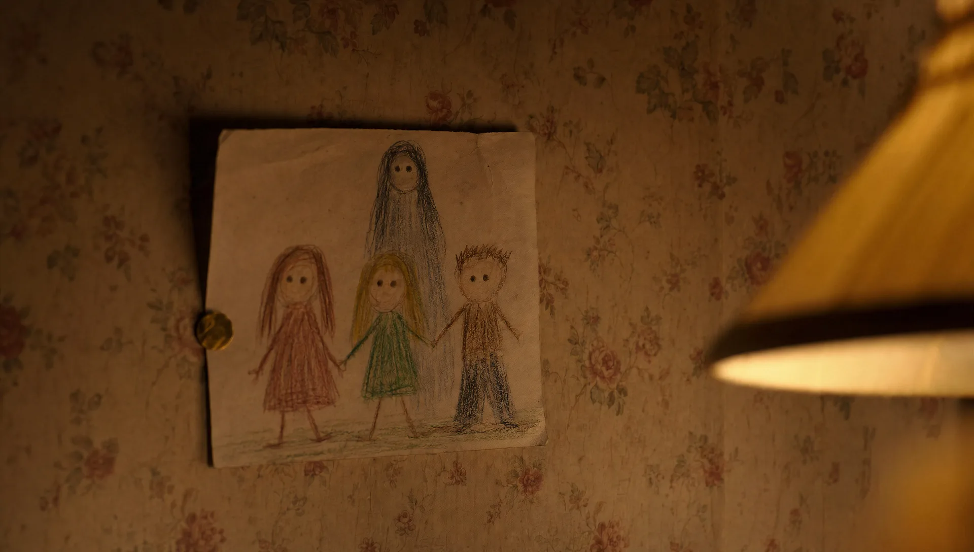 Child's crayon drawing on yellowed wallpaper
